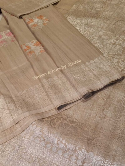 Handwoven Benarasi Tussar georgette silk saree, with beautiful motifs in silver and meena work.